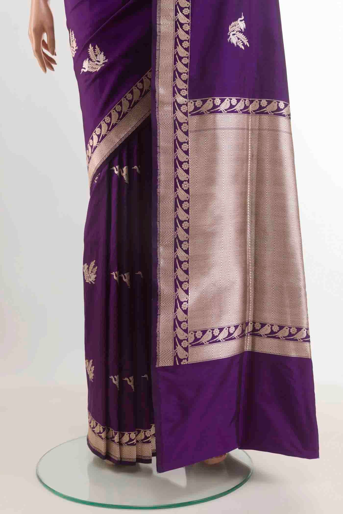Pleats and pallu of Purple Banarasi Silk Saree with Zari Butta on the body and Zari Border. 