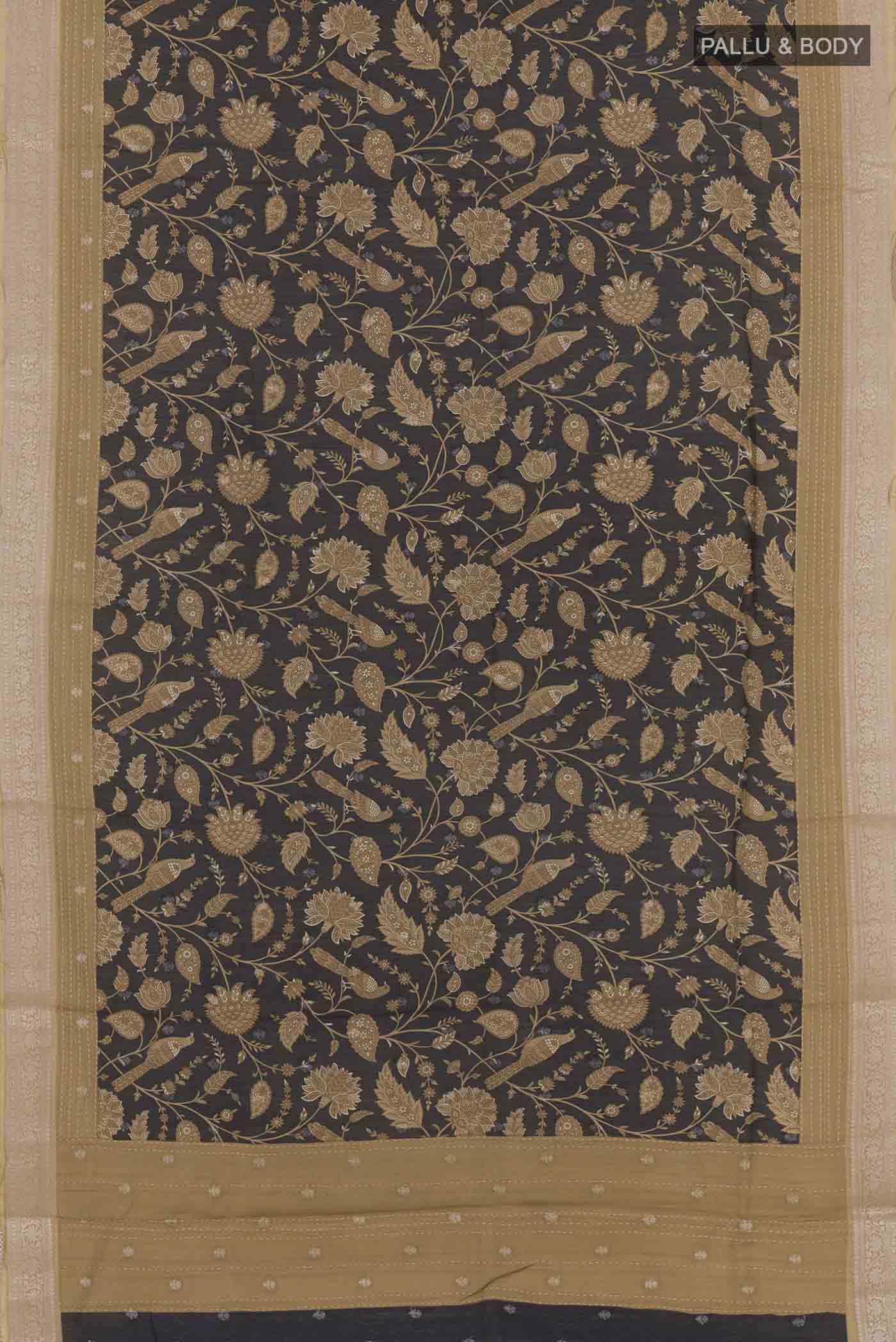 Flat view of Black Tussar Saree with Printed design on the body and Zari Border. 