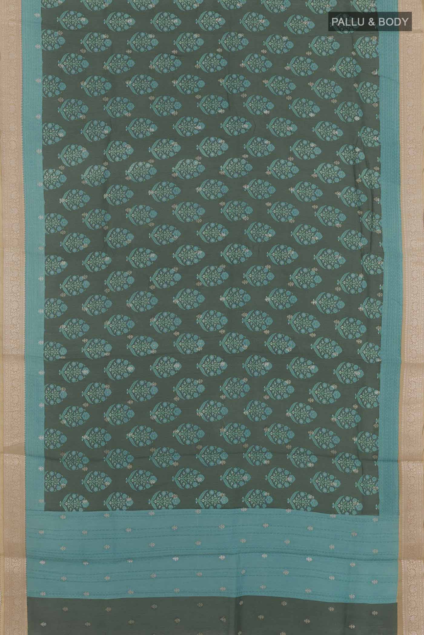 Flat view of Green Tussar Saree with Printed design on the body and Zari Border. 