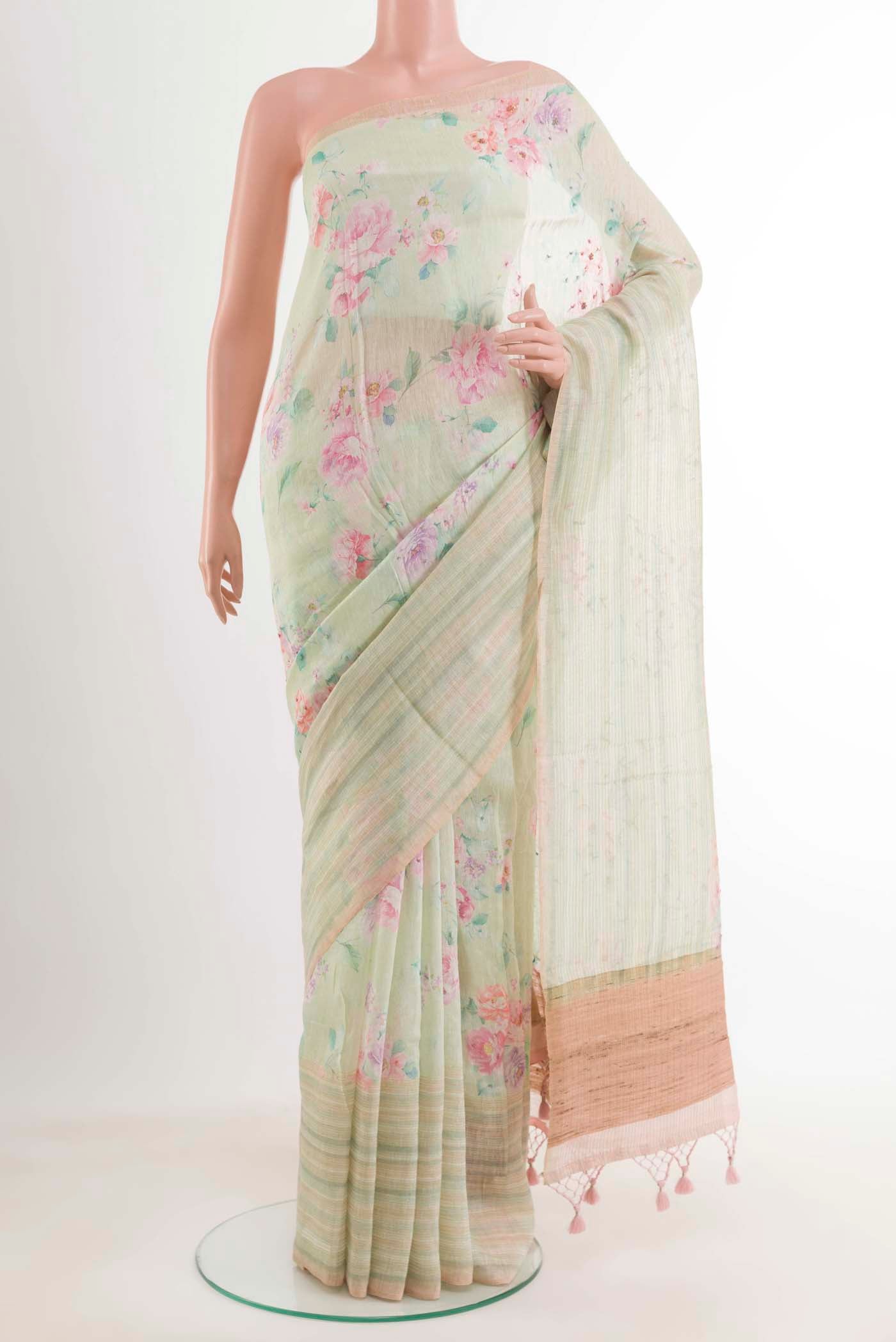 Yellow Linen Saree with Printed design on the body and Zari Border.  displayed on a mannequin