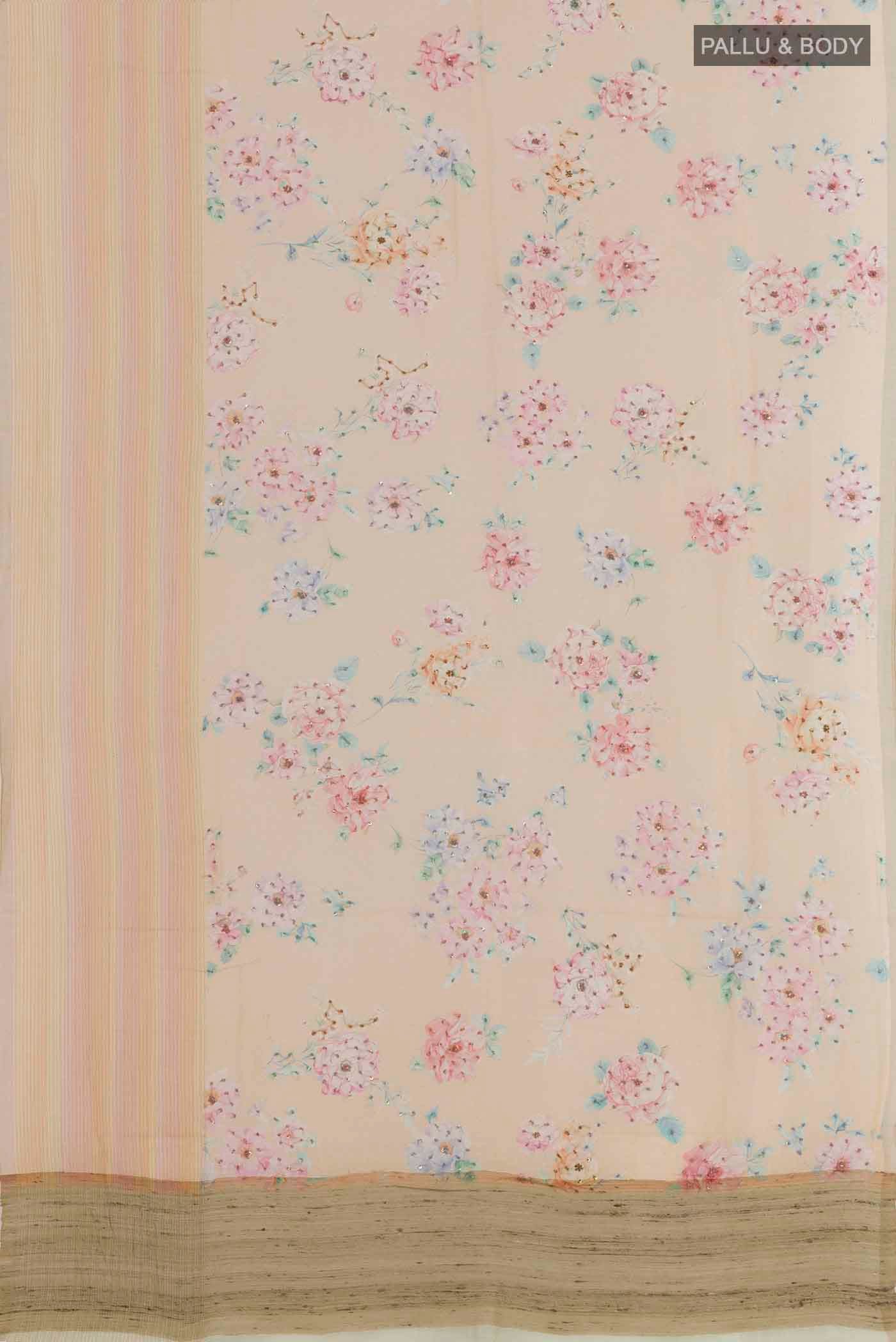 Flat view of Peach Linen Saree with Printed design on the body and Zari Border. 