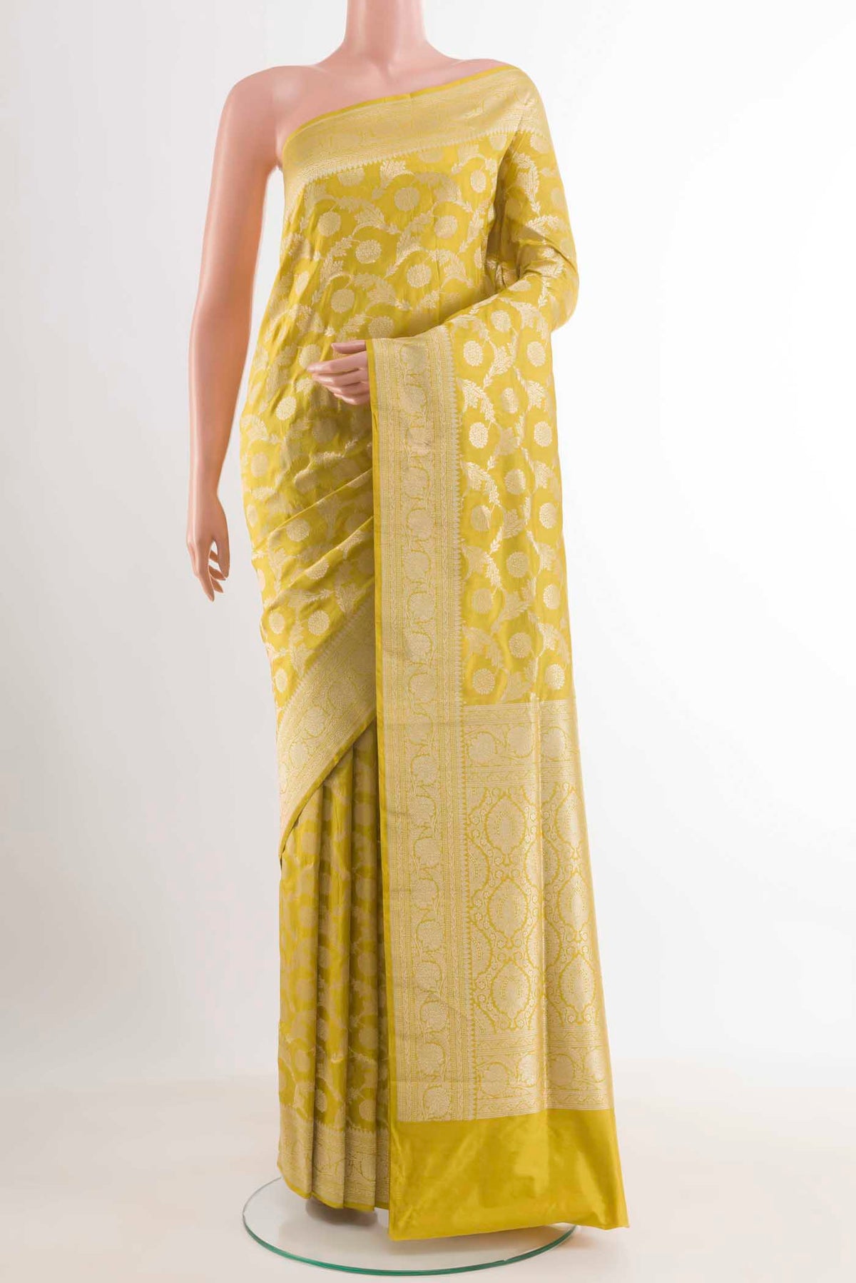 Yellow Banarasi Silk Saree with Zari Brocade on the body and Zari Border.  displayed on a mannequin