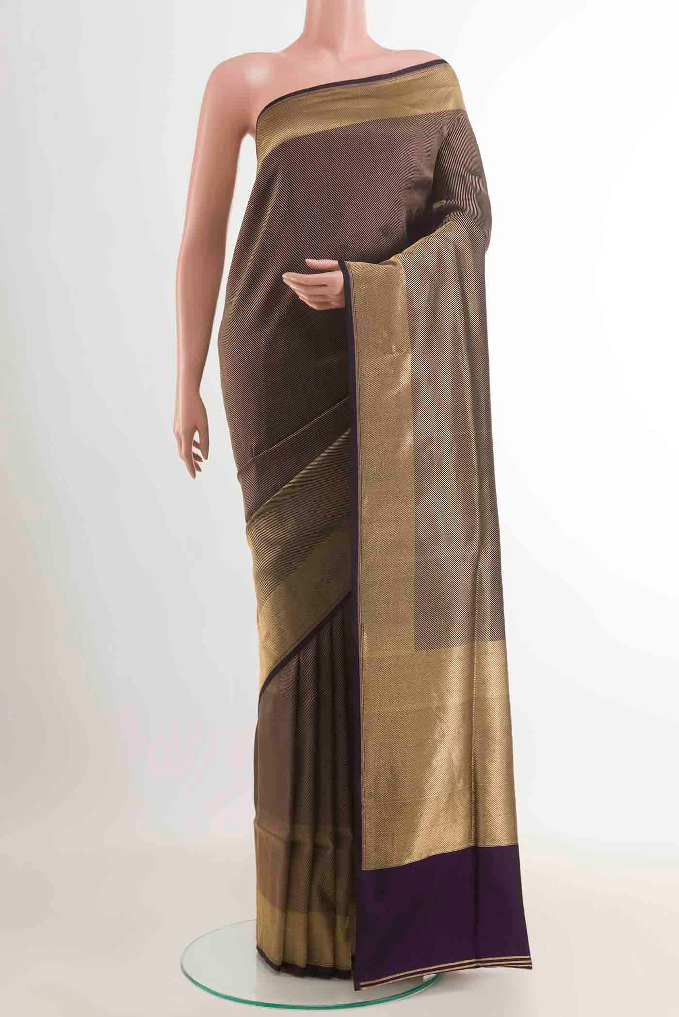 Gold Banarasi Silk Saree with Zari Brocade on the body and Zari Border displayed on a mannequin