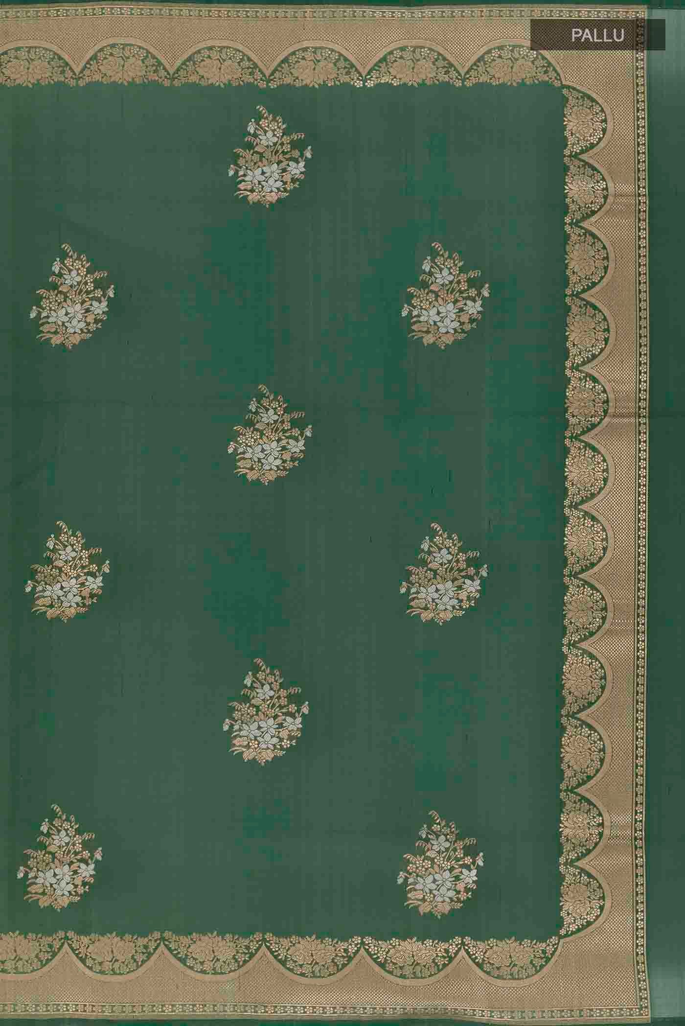 Close up image of the pallu of Green Banarasi Silk Saree with Zari Butta on the body and Zari Border. 