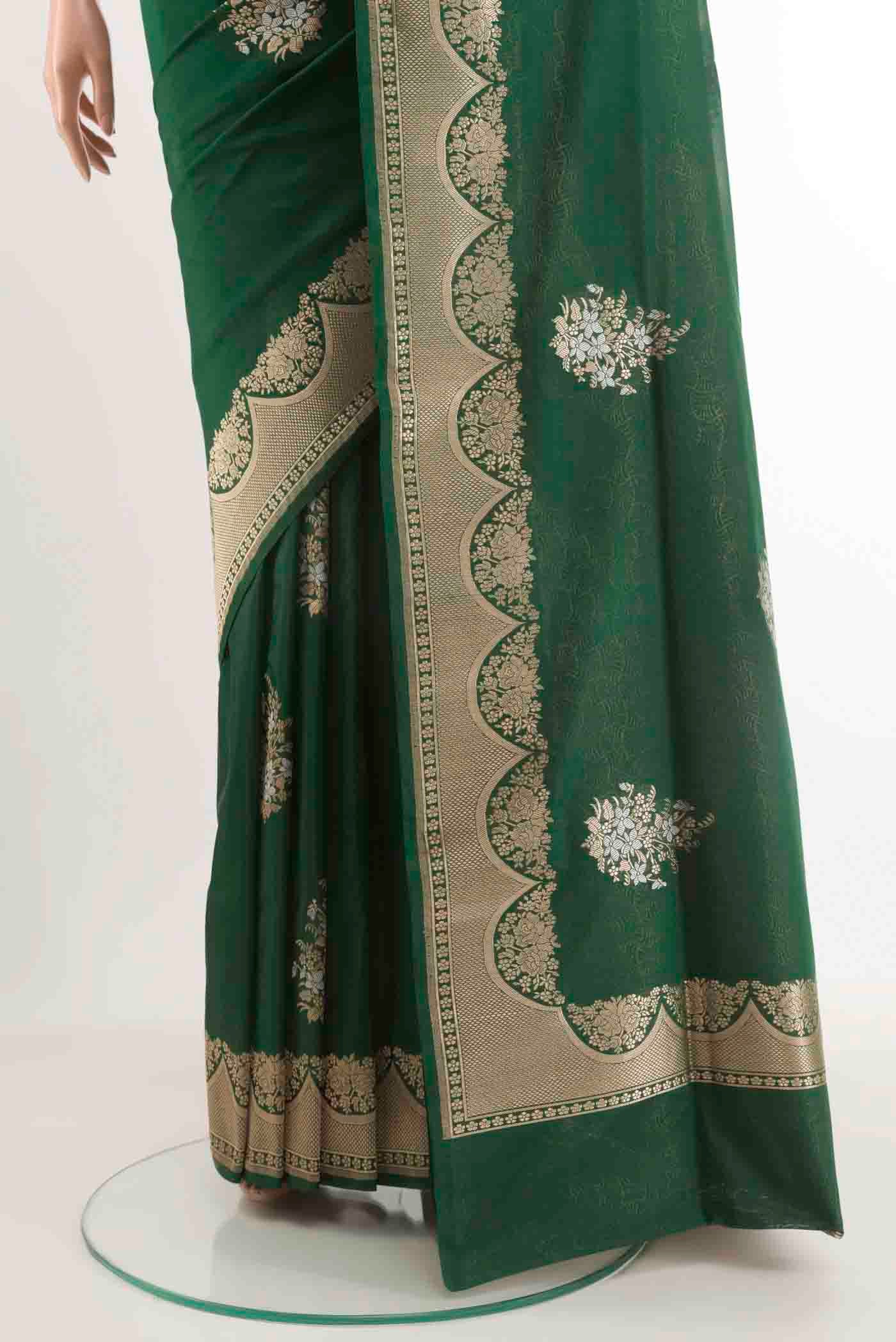 Pleats and pallu of Green Banarasi Silk Saree with Zari Butta on the body and Zari Border. 