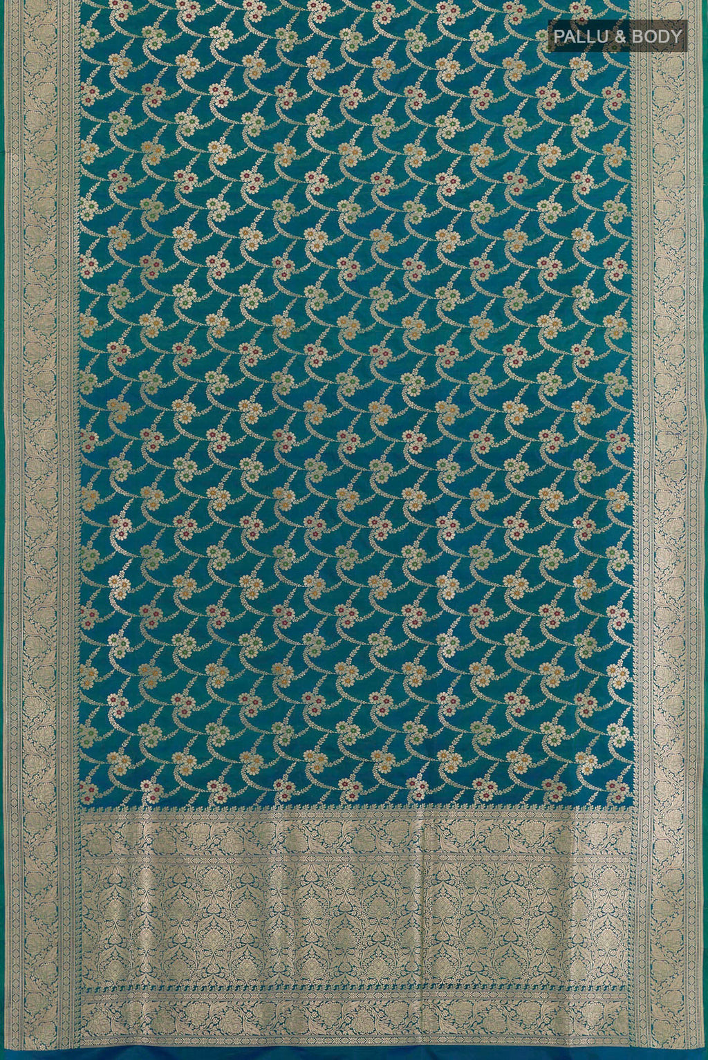 Flat view of Peacock Blue Banarasi Silk Saree with Zari Butta on the body and Zari Border. 