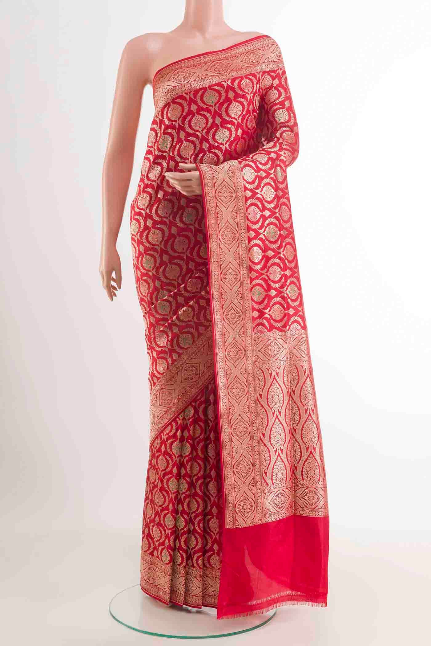 Red Banarasi Silk Saree with Zari Butta on the body and Zari Border displayed on a mannequin