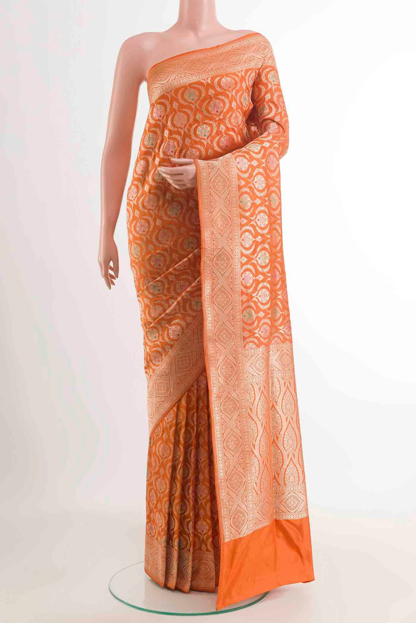 Mustard Banarasi Silk Saree with Zari Butta on the body and Zari Border displayed on a mannequin