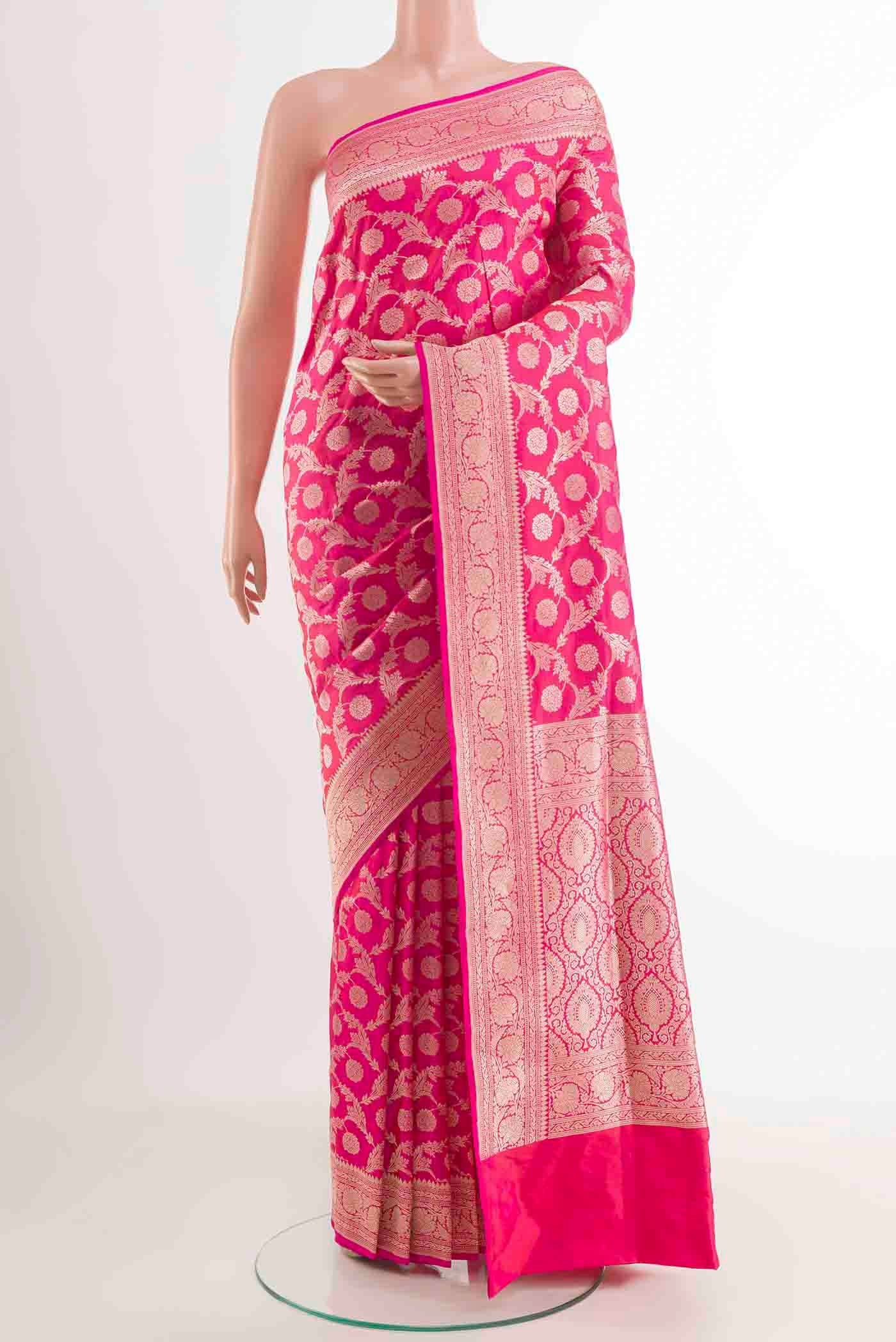 Pink Banarasi Silk Saree with Zari Butta on the body and Zari Border displayed on a mannequin