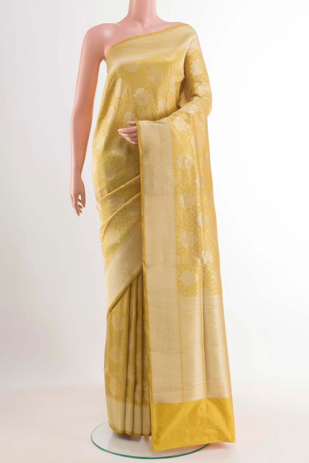 Yellow Banarasi Silk Saree with Zari Brocade on the body and Zari Border.  displayed on a mannequin