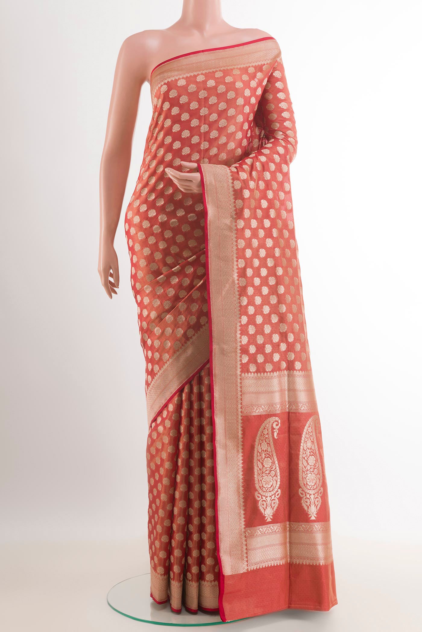Peach Banarasi Tissue Silk Saree with Zari Butta on the body and Zari Border.  displayed on a mannequin