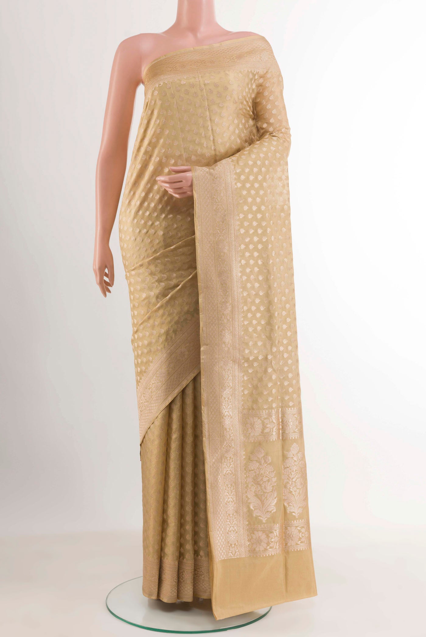 Beige Banarasi Silk Saree with Zari Butta on the body and Zari Border.  displayed on a mannequin