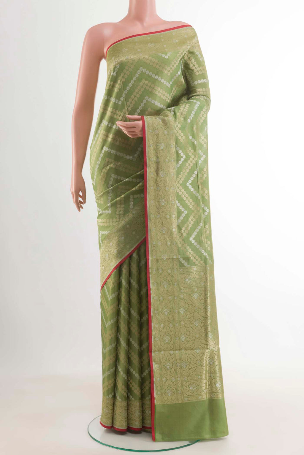 Green Banarasi Silk Saree with Zari Brocade on the body and Zari Border.  displayed on a mannequin