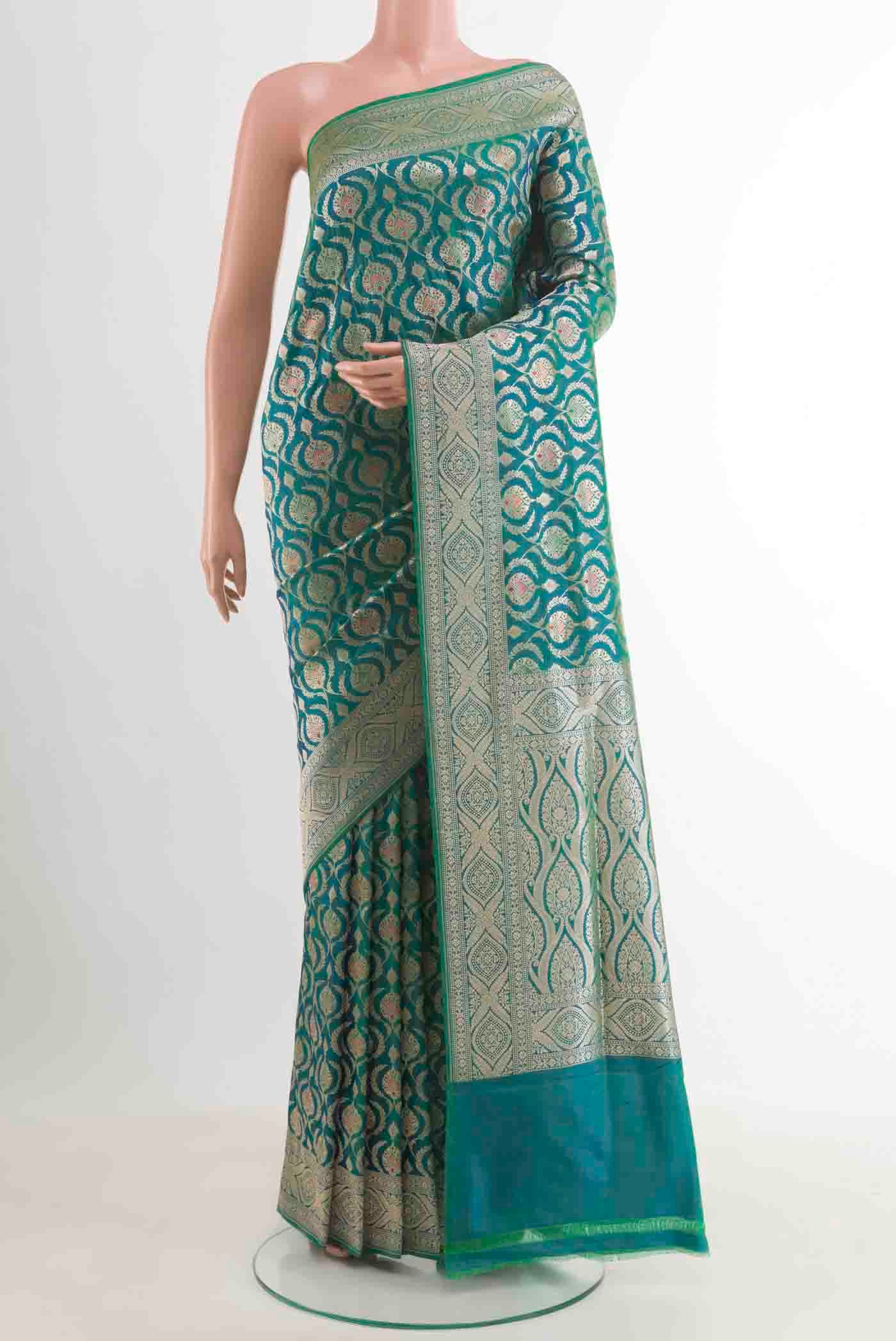 Sea Green Banarasi Silk Saree with Zari Brocade on the body and Zari Border.  displayed on a mannequin