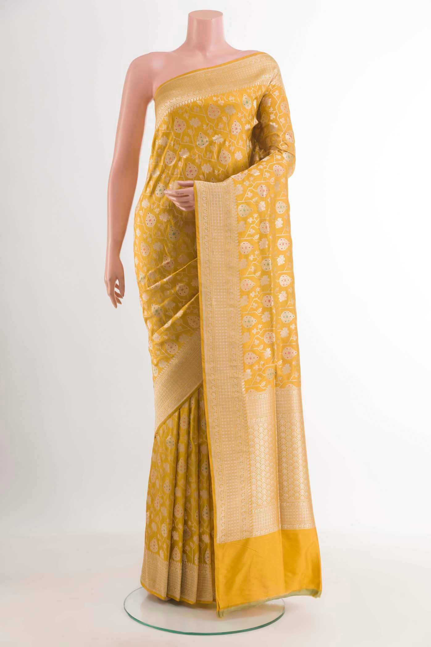 Yellow Banarasi Silk Saree with Zari Brocade on the body and Zari Border.  displayed on a mannequin