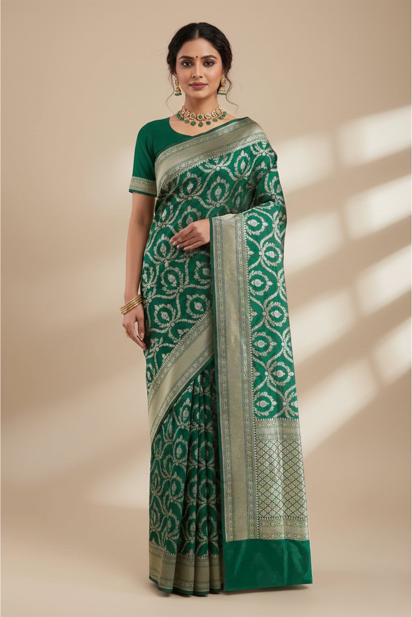 Model wearing a Green Banarasi Silk Saree with Zari Brocade on the body and Zari Border.