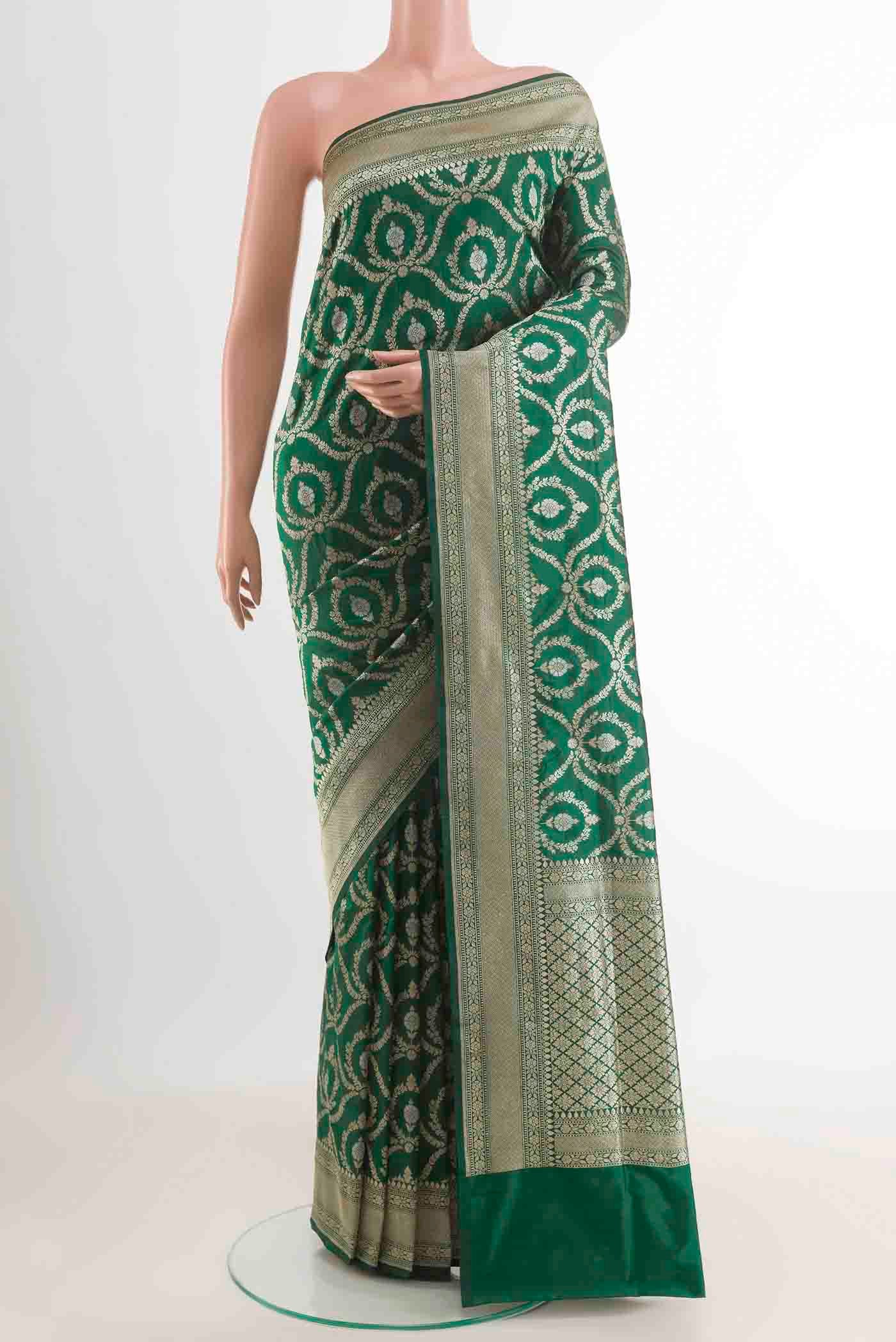 Green Banarasi Silk Saree with Zari Brocade on the body and Zari Border displayed on a mannequin