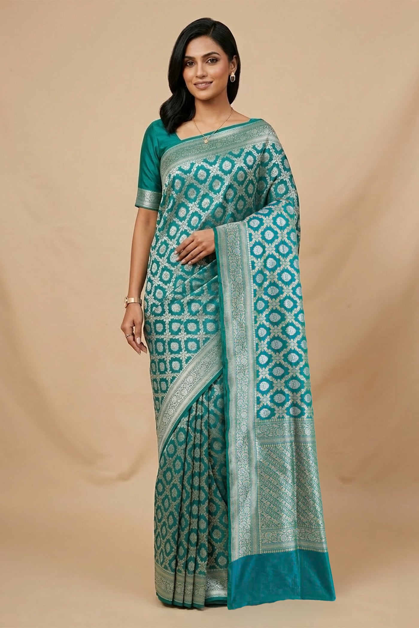 Model wearing a Teal Banarasi Silk Saree with Zari Brocade on the body and Zari Border.