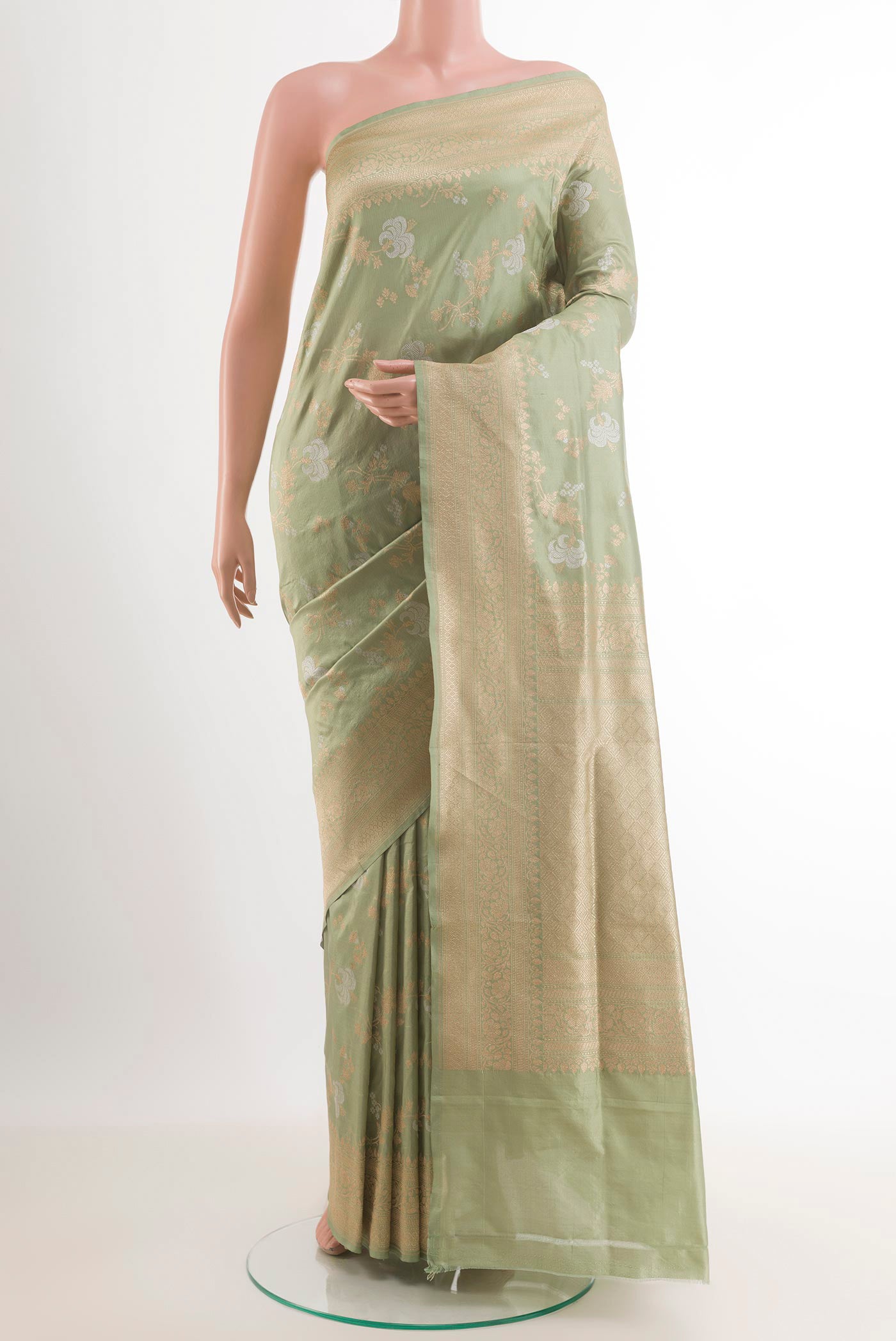 Light Green Banarasi Silk Saree with Zari Brocade on the body and Zari Border.  displayed on a mannequin