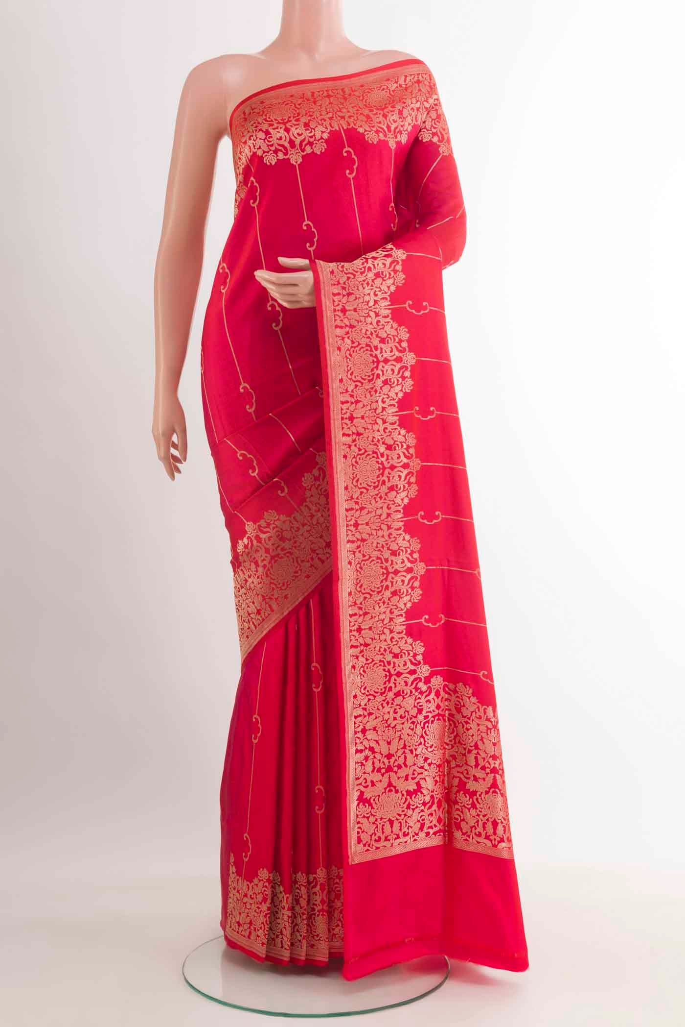Red Banarasi Silk Saree with Stripes on the body and Zari Border.  displayed on a mannequin