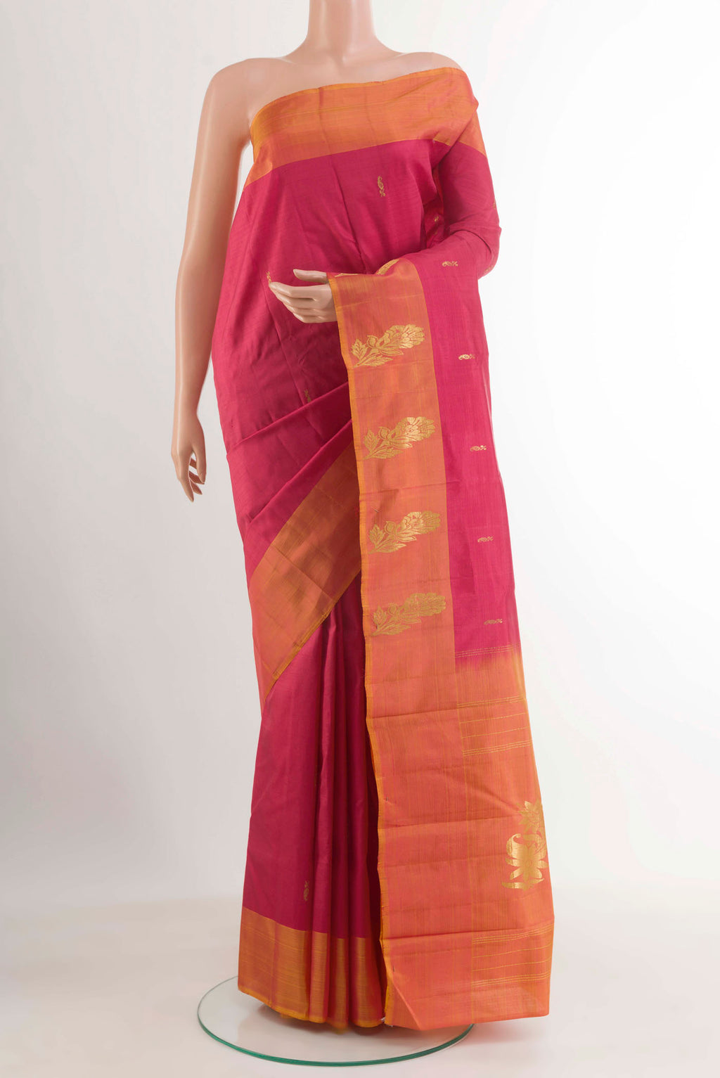 Red Kanjivaram Silk Saree with Zari Butta on the body and Zari Border.  displayed on a mannequin
