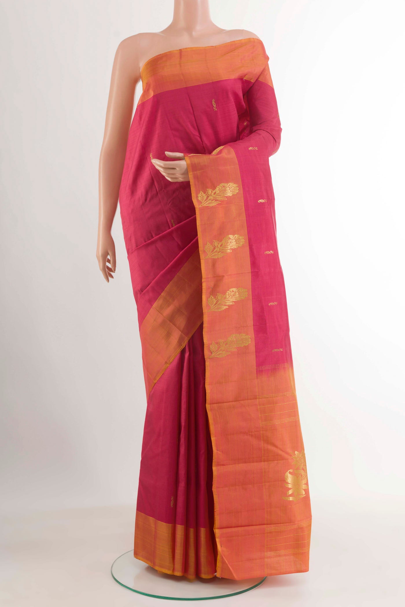 Red Kanjivaram Silk Saree with Zari Butta on the body and Zari Border.  displayed on a mannequin
