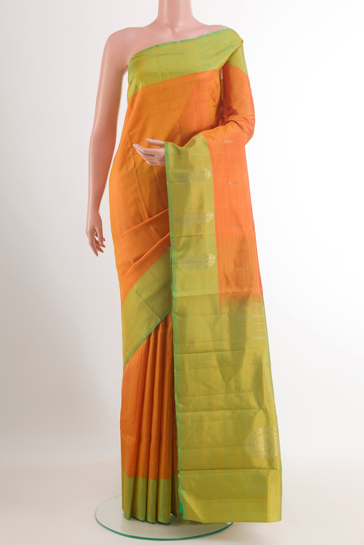 Orange Kanjivaram Silk Saree with Zari Brocade on the body and Zari Border.  displayed on a mannequin