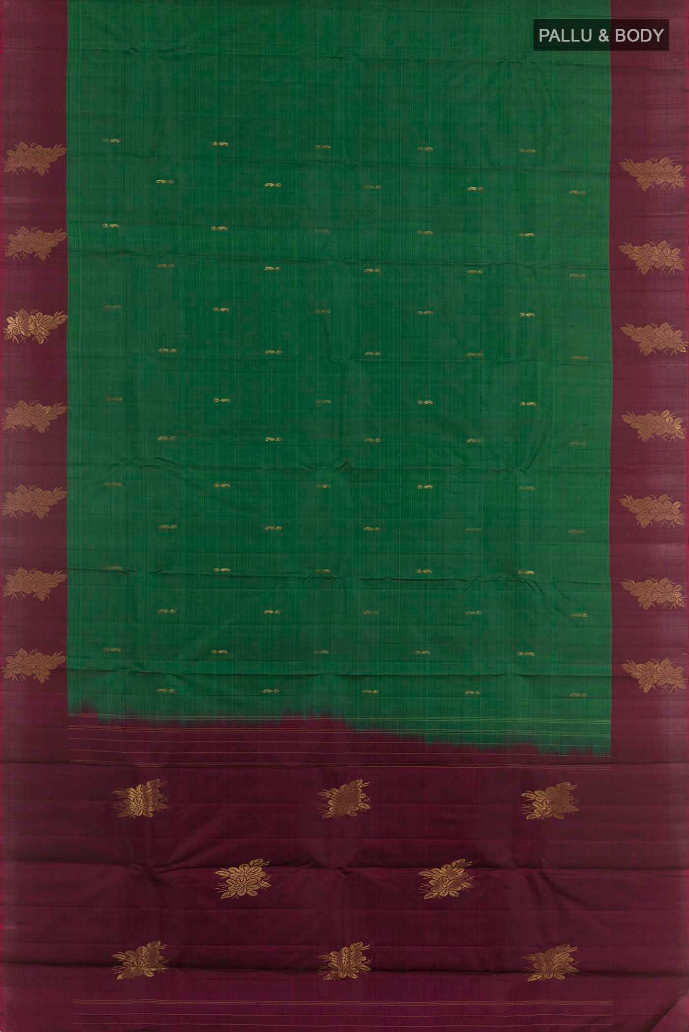 Flat view of Bottle Green Kanjivaram Silk Saree with Zari Butta on the body and Zari Border. 