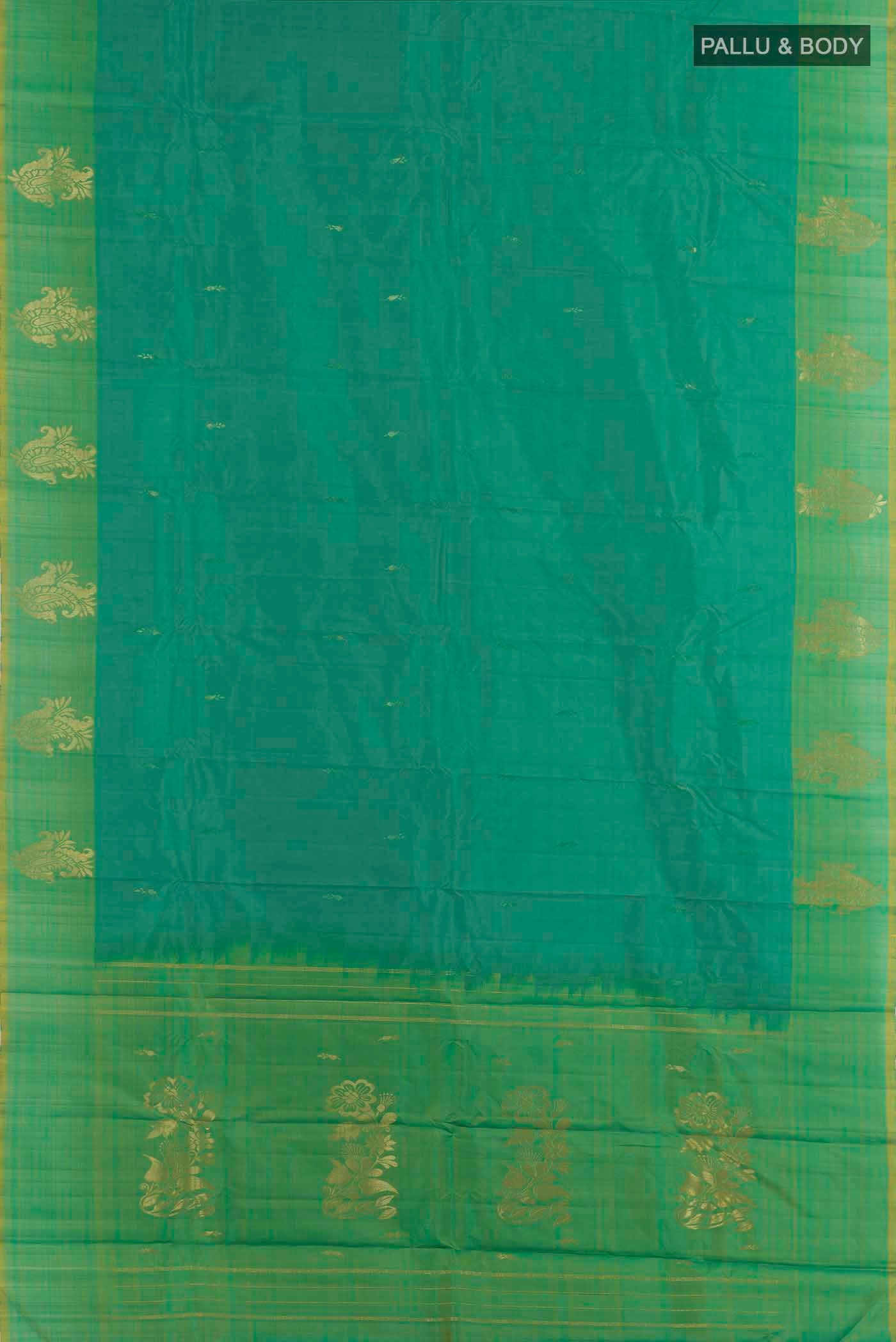 Flat view of Green Kanjivaram Silk Saree with Zari Butta on the body and Zari Border. 