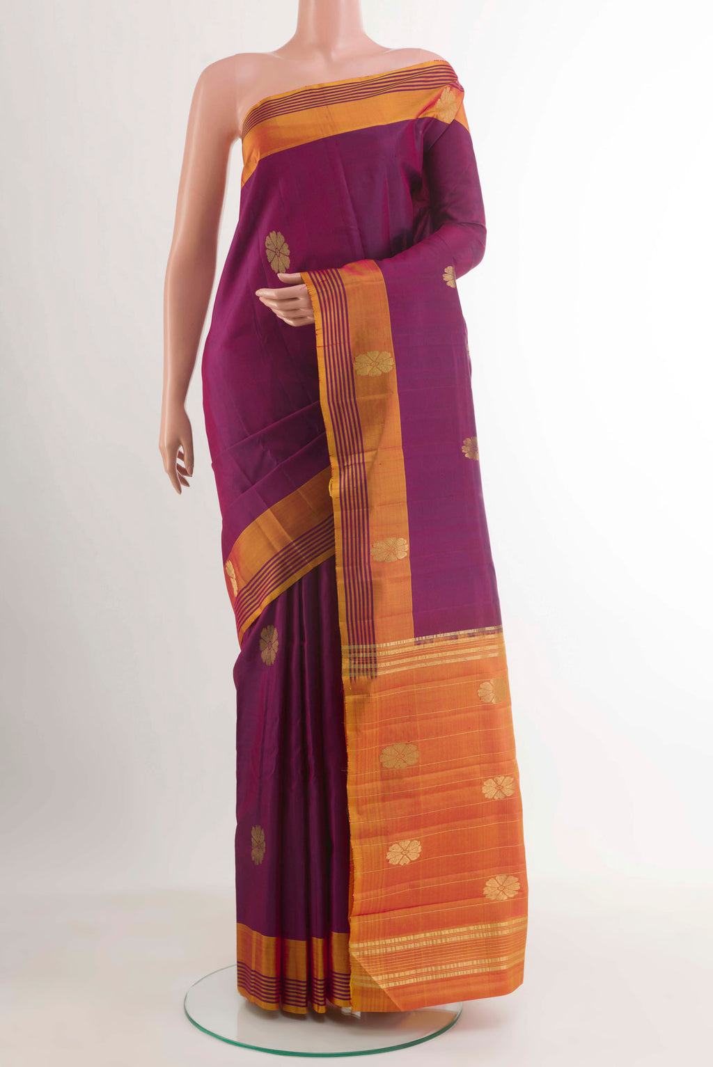 Purple Kanchipuram Silk Saree with Zari Butta on the body and Zari Border.  displayed on a mannequin