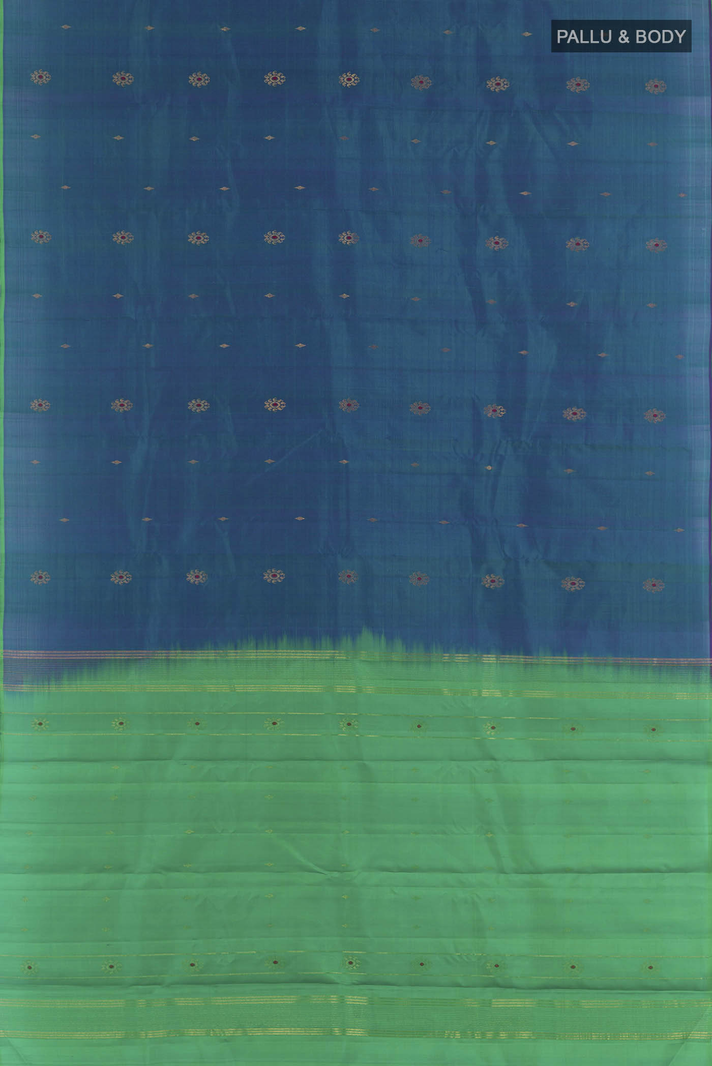 Flat view of Peacock Blue Kanchipuram Silk Saree with Zari Butta on the body and Zari Border. 