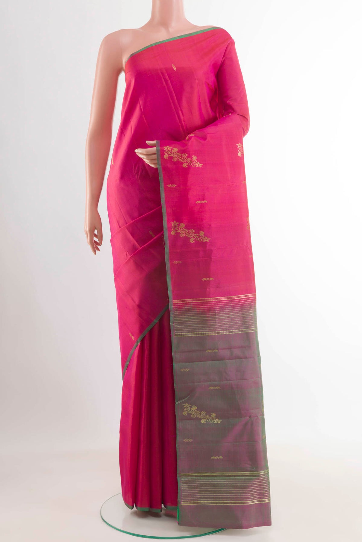 Pink Kanchipuram Saree with Zari Butta on the body and Zari Border.  displayed on a mannequin