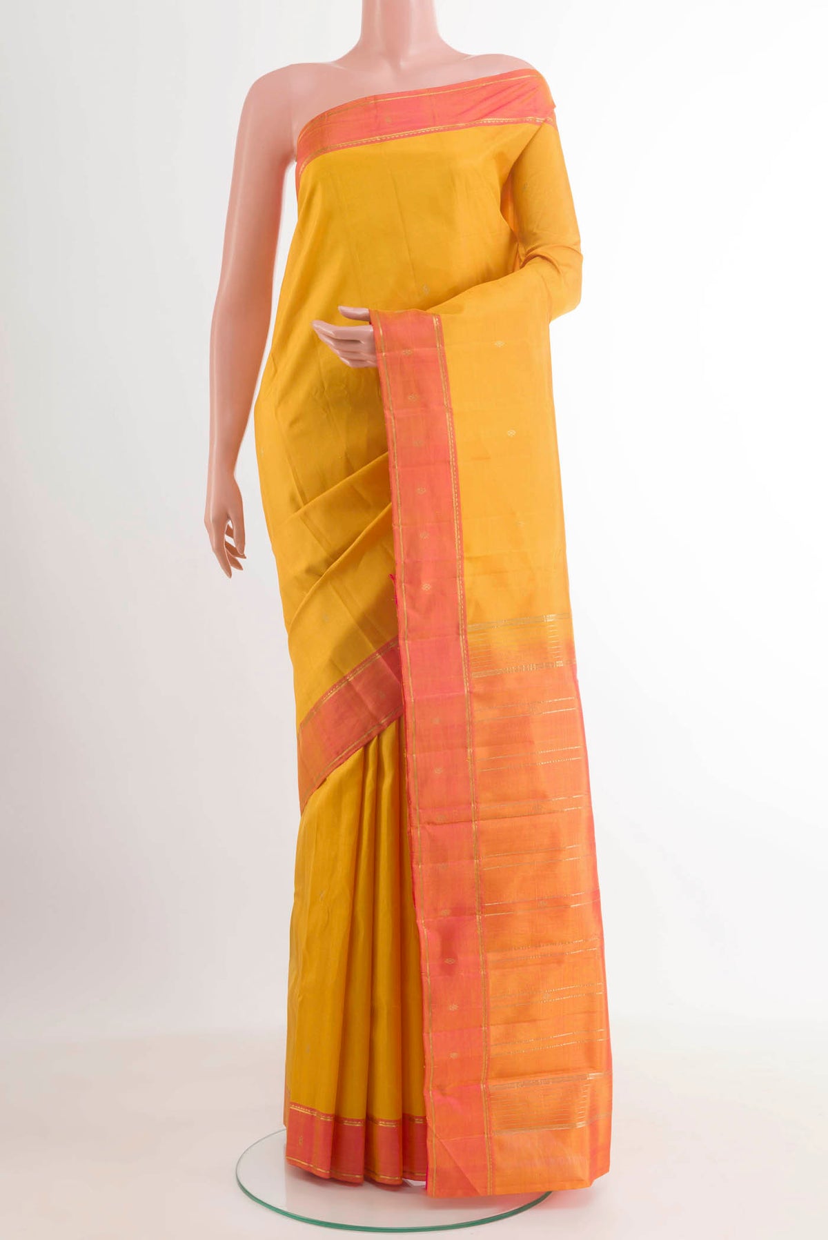 Yellow Kanchipuram Silk Saree with Zari Butta on the body and Zari Border.  displayed on a mannequin