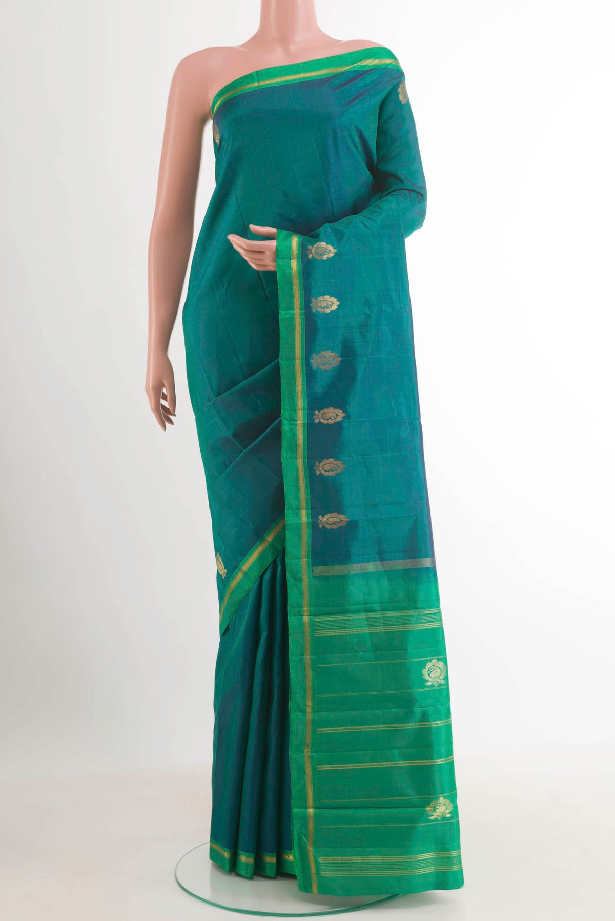 Peacock Blue Dual Tone Kanchipuram Silk Saree with Zari Butta on the body and Zari Border.  displayed on a mannequin