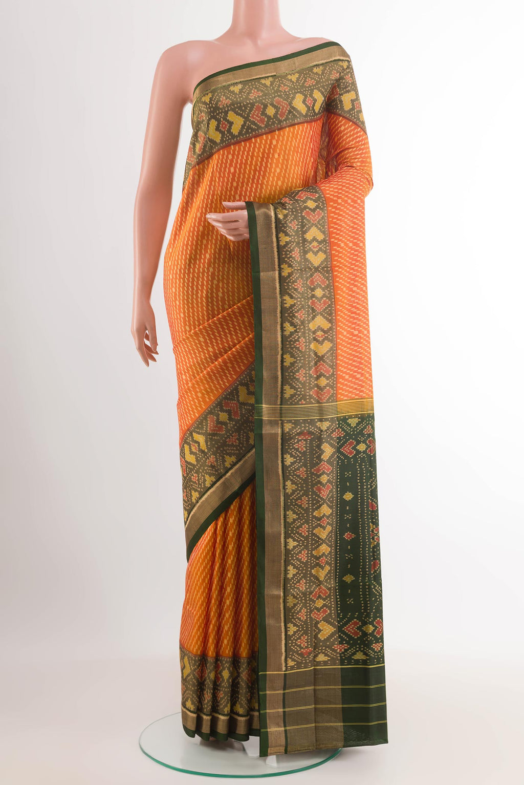 Yellow Rajkot Patola Silk Saree with Ikat design on the body and Zari Border.  displayed on a mannequin