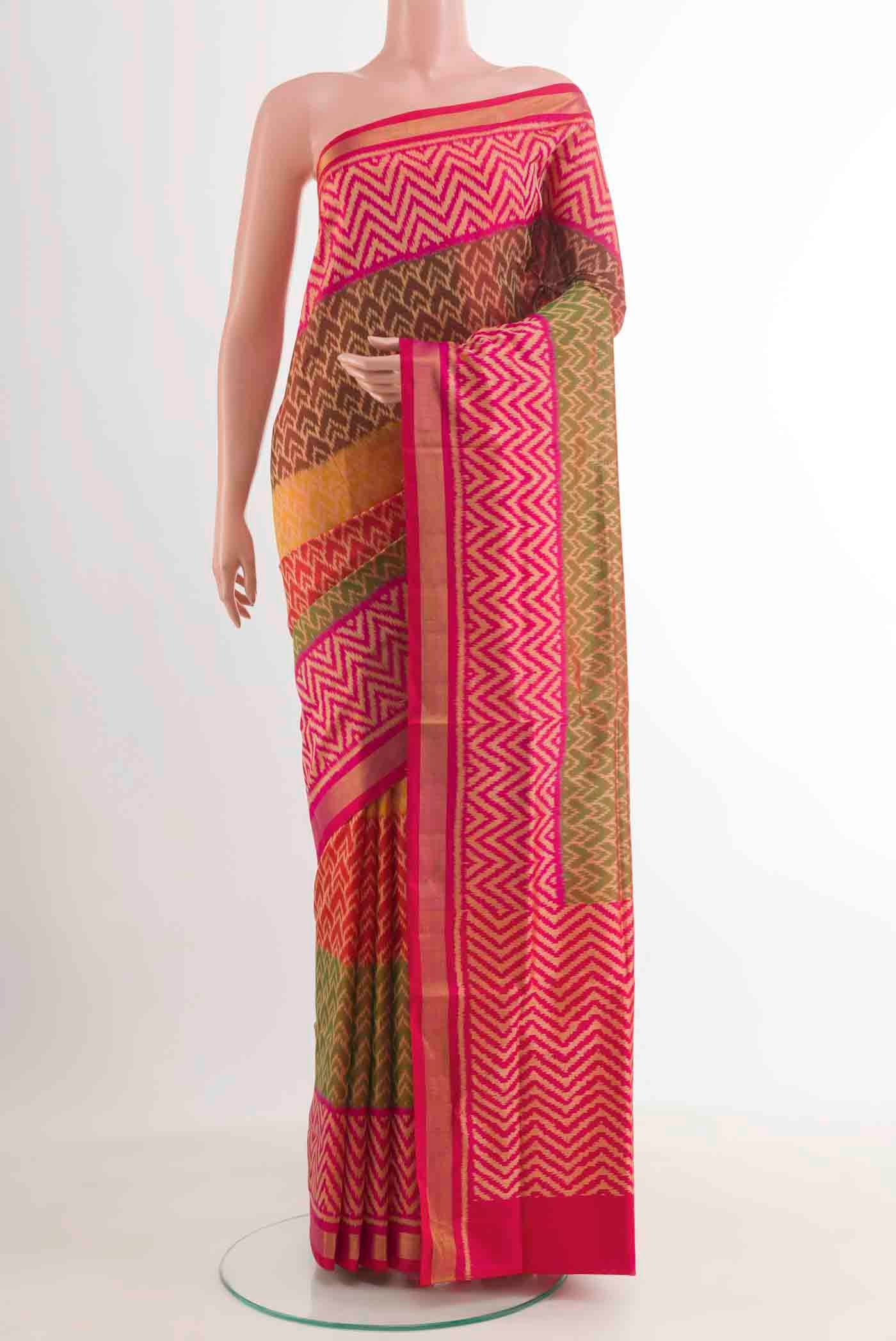 Multi Color Rajkot Patola Silk Saree with Pure Ikat on the body and Zari Border.  displayed on a mannequin