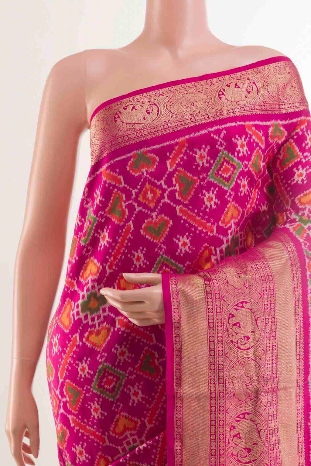 Border image of Rani Pink Rajkot Patola Silk Saree with Pure Ikat on the body and Zari Border. 