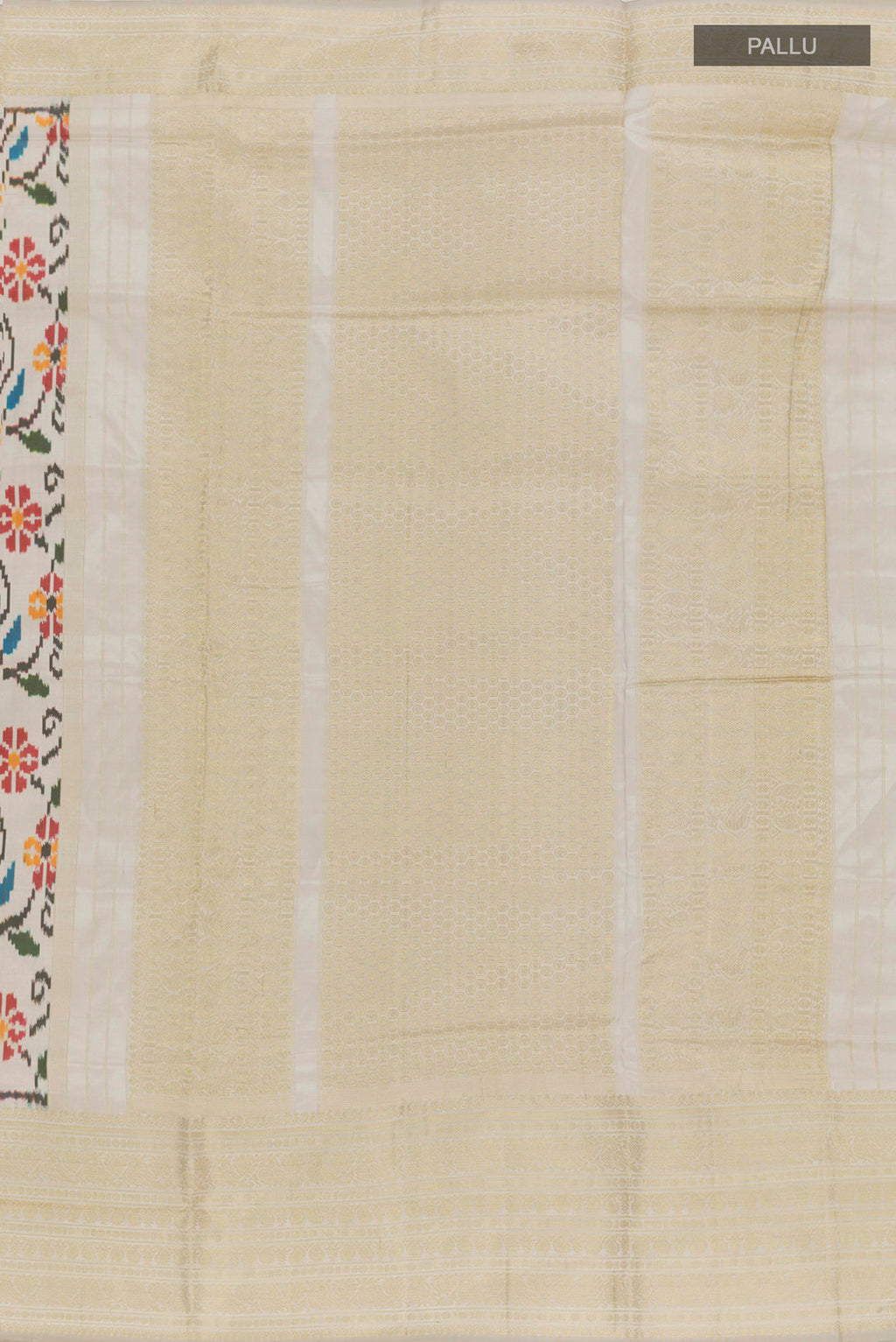 Close up image of the pallu of Off White Rajkot Patola Silk Saree with Ikat design on the body and Zari Border. 