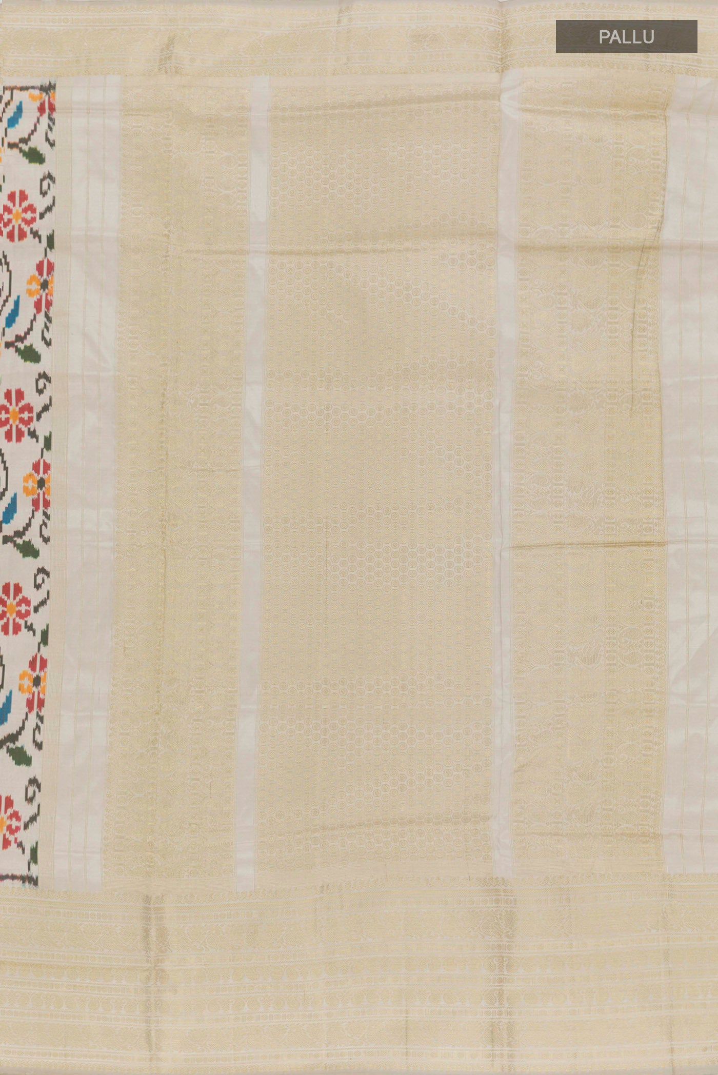 Close up image of the pallu of Off White Rajkot Patola Silk Saree with Ikat design on the body and Zari Border. 