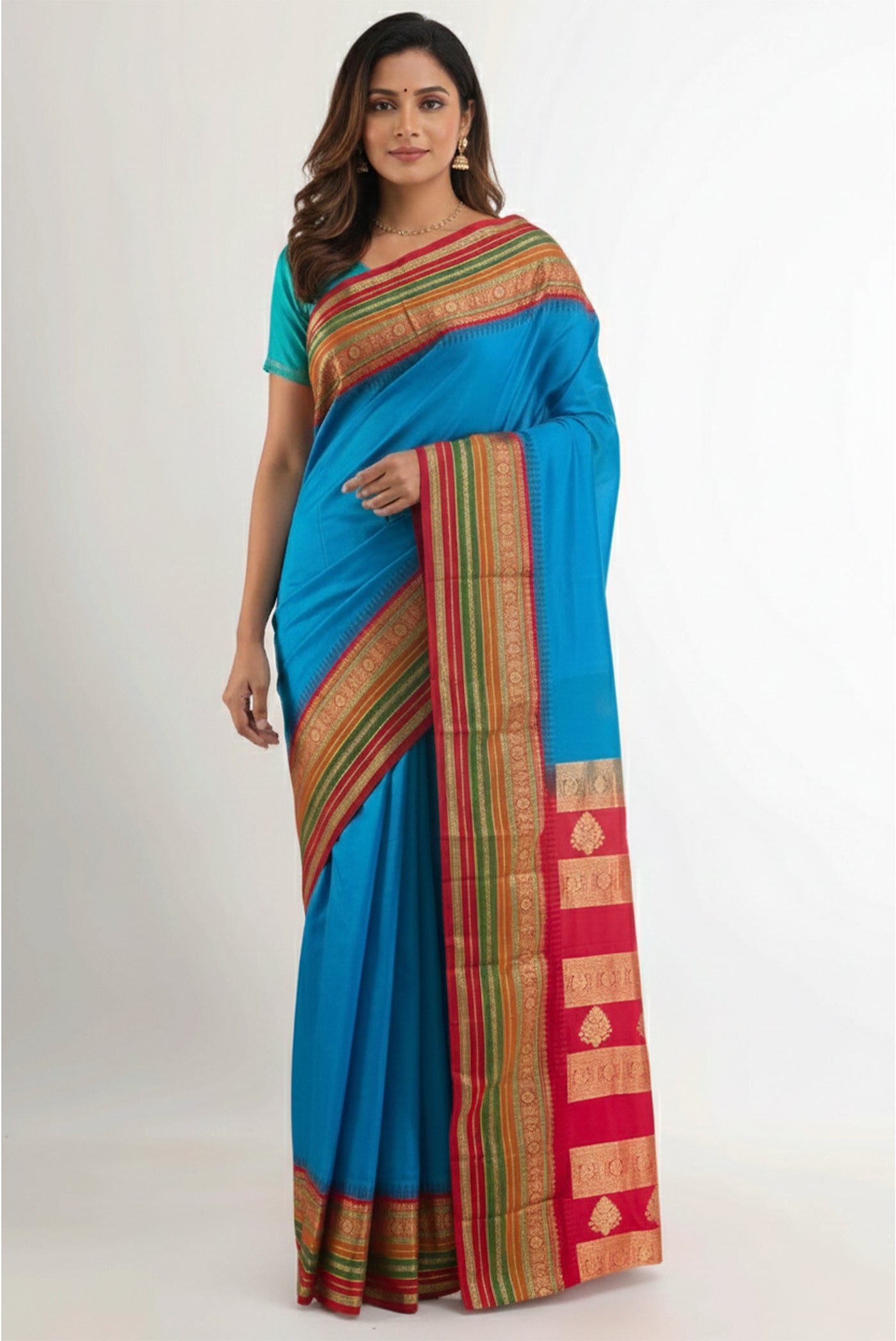 Model wearing a Blue Bangalore Silk Saree with Plain Body and Zari Border.
