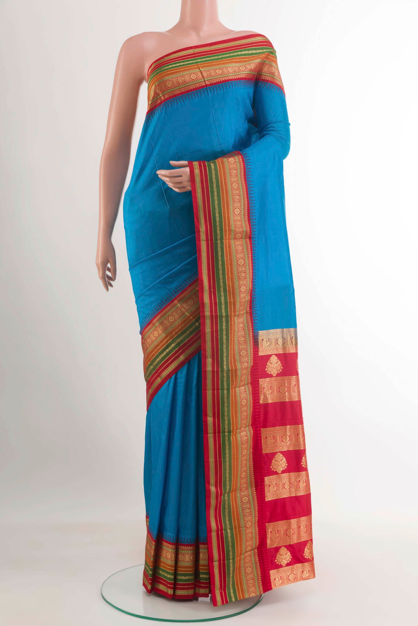 Blue Kanjivaram Silk Saree with Plain Body and Zari Border.  displayed on a mannequin
