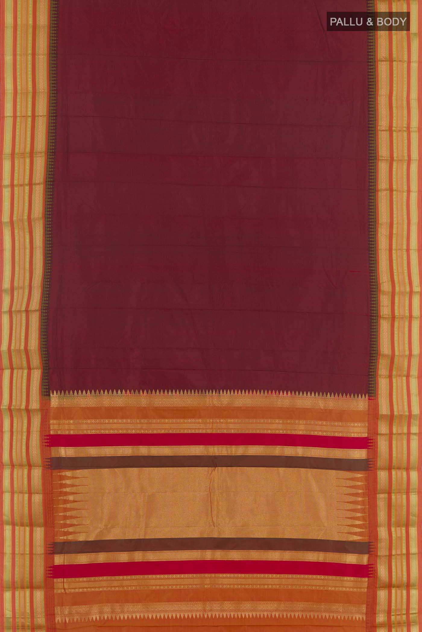Flat view of Maroon Kanjivaram Silk Saree with Plain Body and Zari Border. 