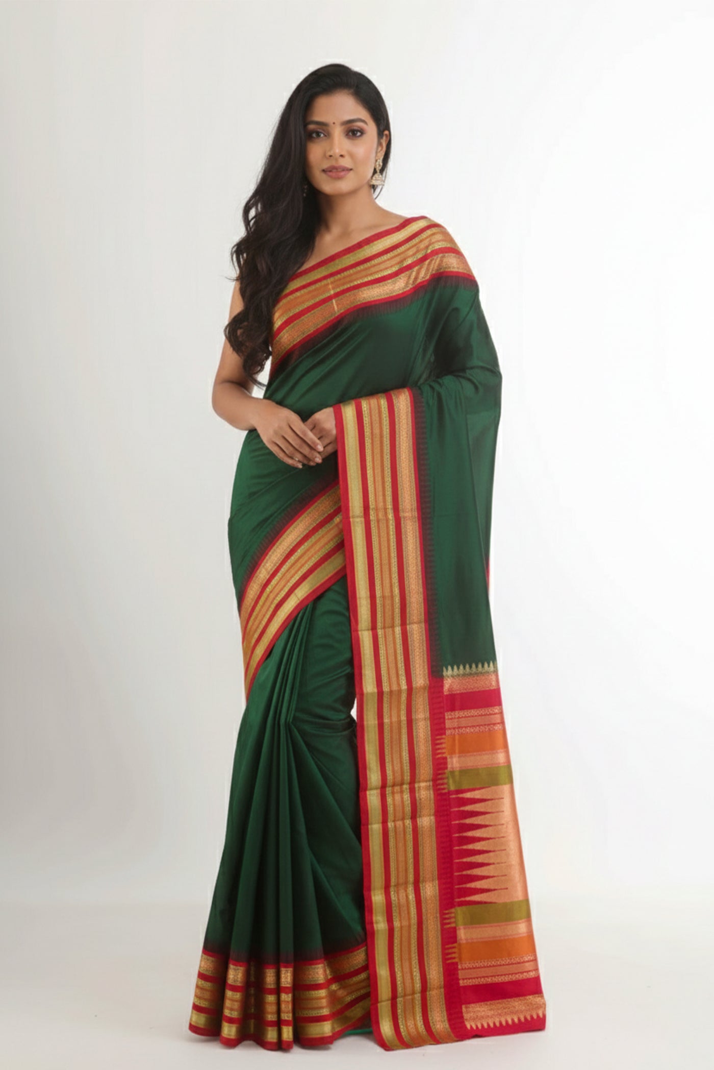 Model wearing a Bottle Green Bangalore Silk Saree with Plain Body and Zari Border.