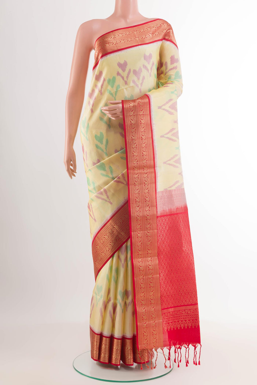Lemon Yellow Soft Silk Saree with Ikat design on the body and Zari Border.  displayed on a mannequin