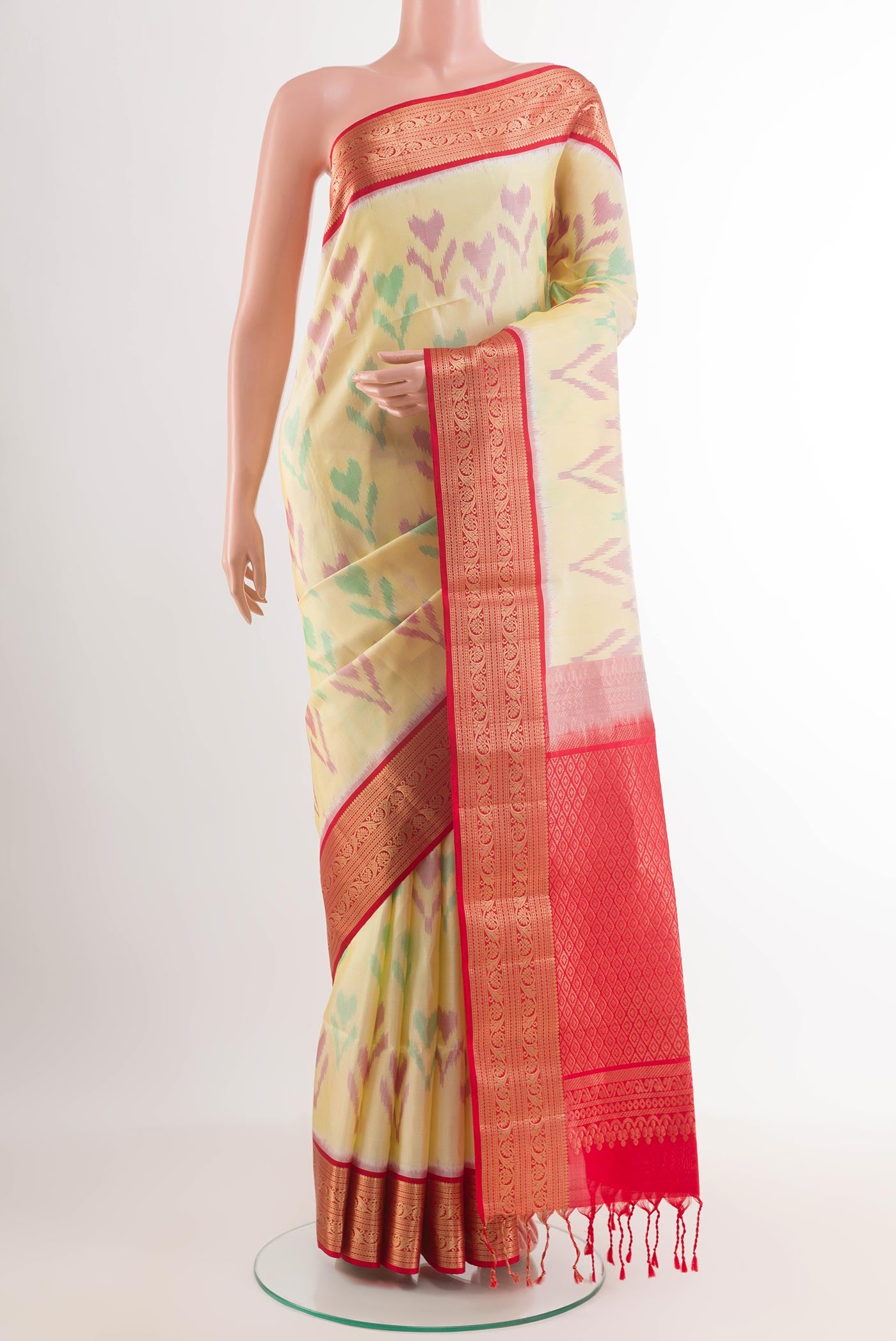 Lemon Yellow Soft Silk Saree with Ikat design on the body and Zari Border.  displayed on a mannequin