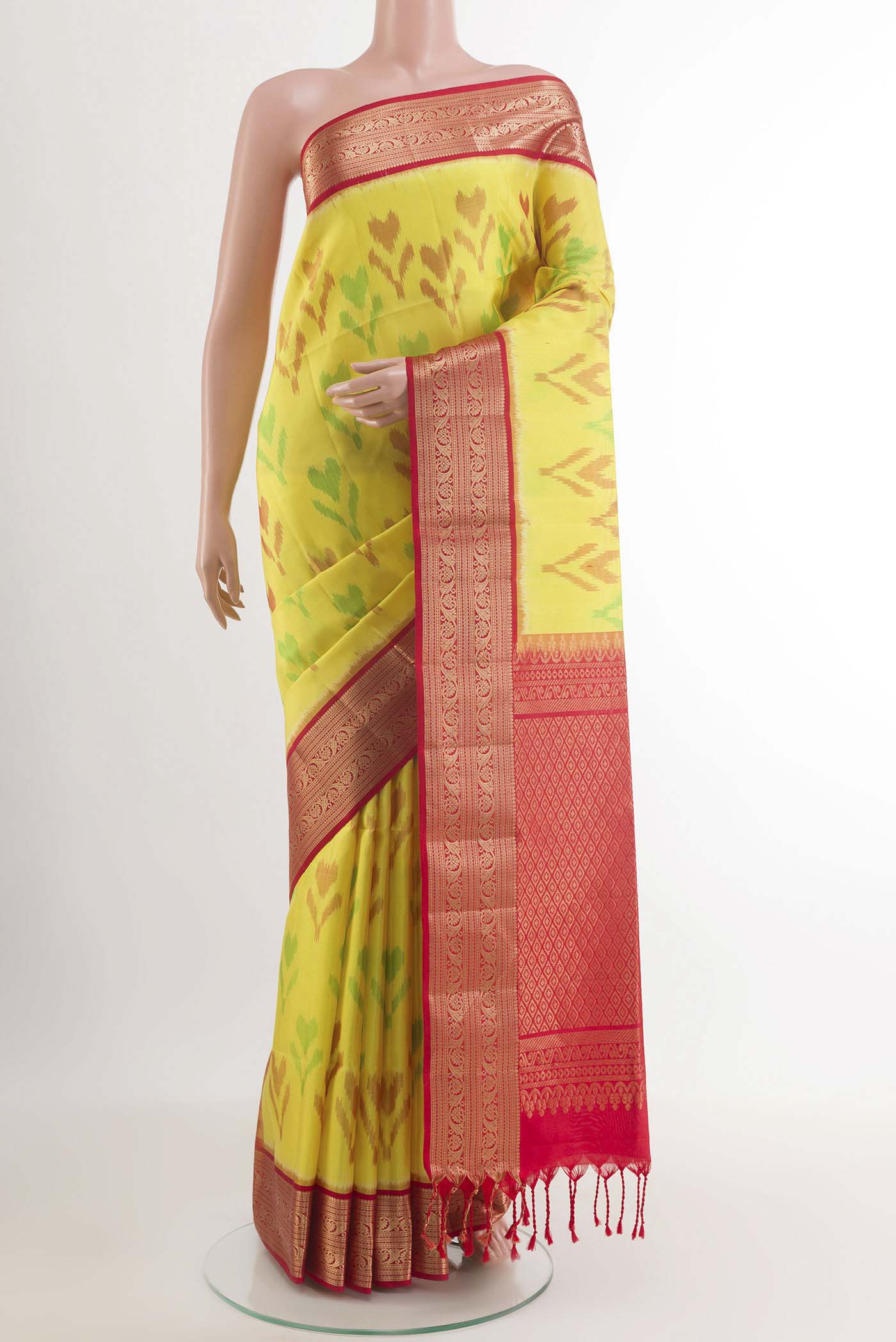 Yellow Soft Silk Saree with Pure Ikat on the body and Zari Border.  displayed on a mannequin