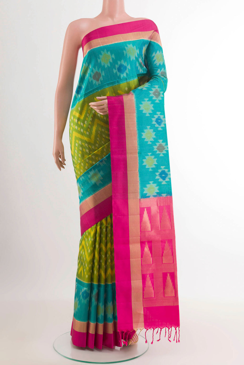 Green Soft Silk Saree with Pure Ikat on the body and Zari Border.  displayed on a mannequin