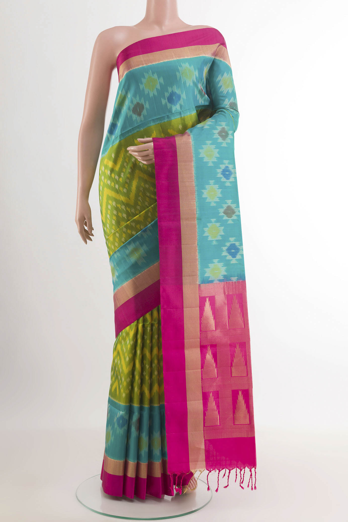 Green Soft Silk Saree with Pure Ikat on the body and Zari Border.  displayed on a mannequin