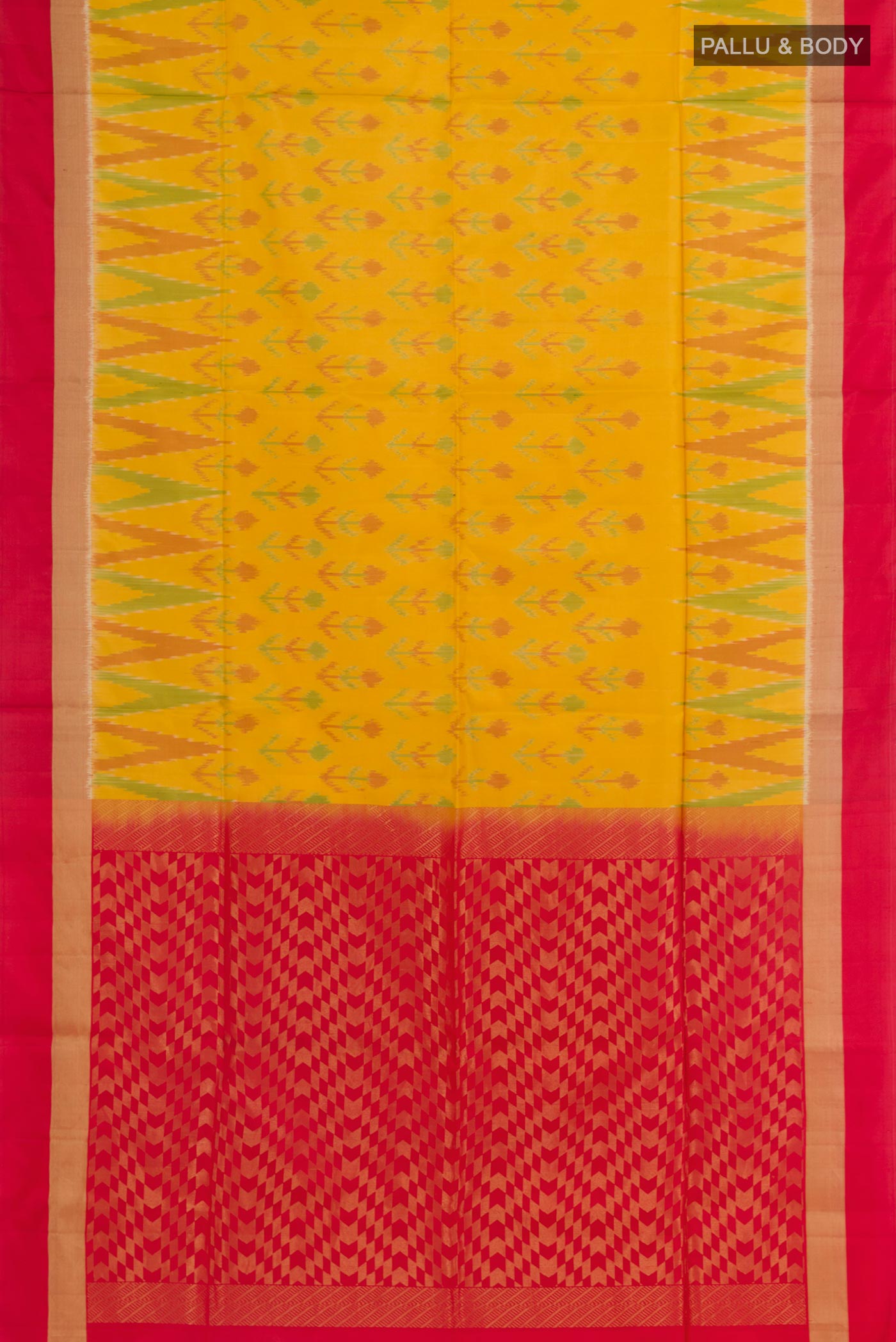 Flat view of Yellow Soft Silk Saree with Ikat design on the body and Zari Border. 
