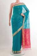 Blue Blended Chanderi Kora Silk Saree with Zari Butta on the body and Zari Border.  displayed on a mannequin